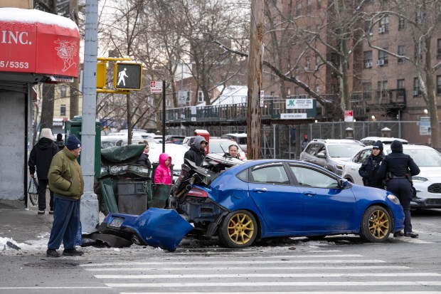 A car hit by an MTA bus is pictured at Tinton Ave. and E. 163rd St. in the Bronx on Monday, Dec. 15, 2025. (Barry Williams/ New York Daily News)