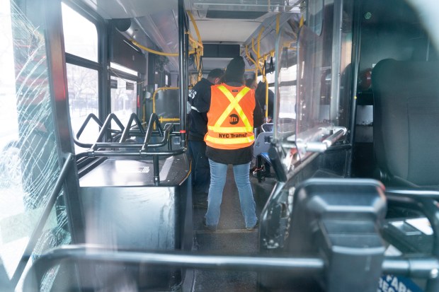 MTA employees are pictured inside a bus that crashed on E. 163rd St. near Prospect Ave. in the Bronx on Monday, Dec. 15, 2025. (Barry Williams/ New York Daily News)