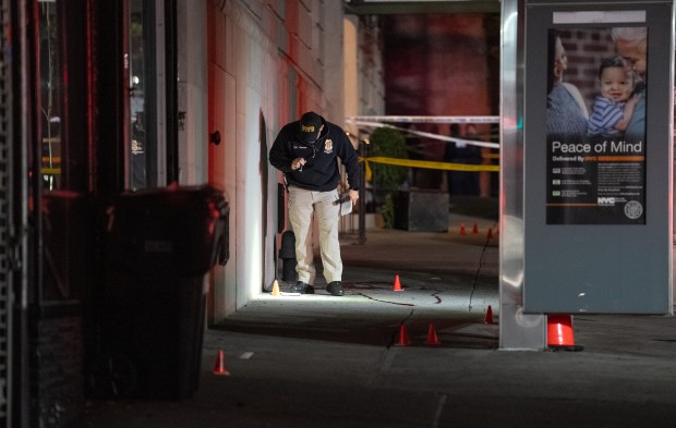 NYPD officers and detectives investigate a police involved shooting on Madison Ave. between E. 95th St. and E. 96th St. Thursday, Nov. 13, 2025. (Barry Williams/ New York Daily News)