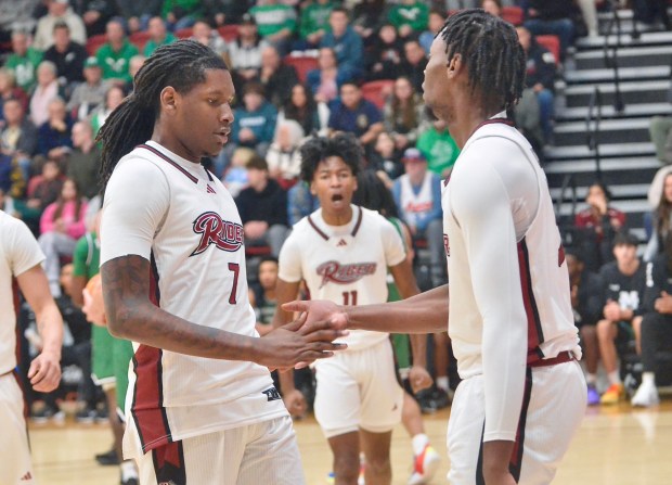 Rider's Davis Bynum, left, and Shemani Fuller, right, react after Fuller scored a basket and was fouled against Manhattan during an NCAA men's basketball game on Monday, Dec. 29, 2025 at Alumni Gymnasium in Lawrenceville. (Kyle Franko/ Trentonian Photo)
