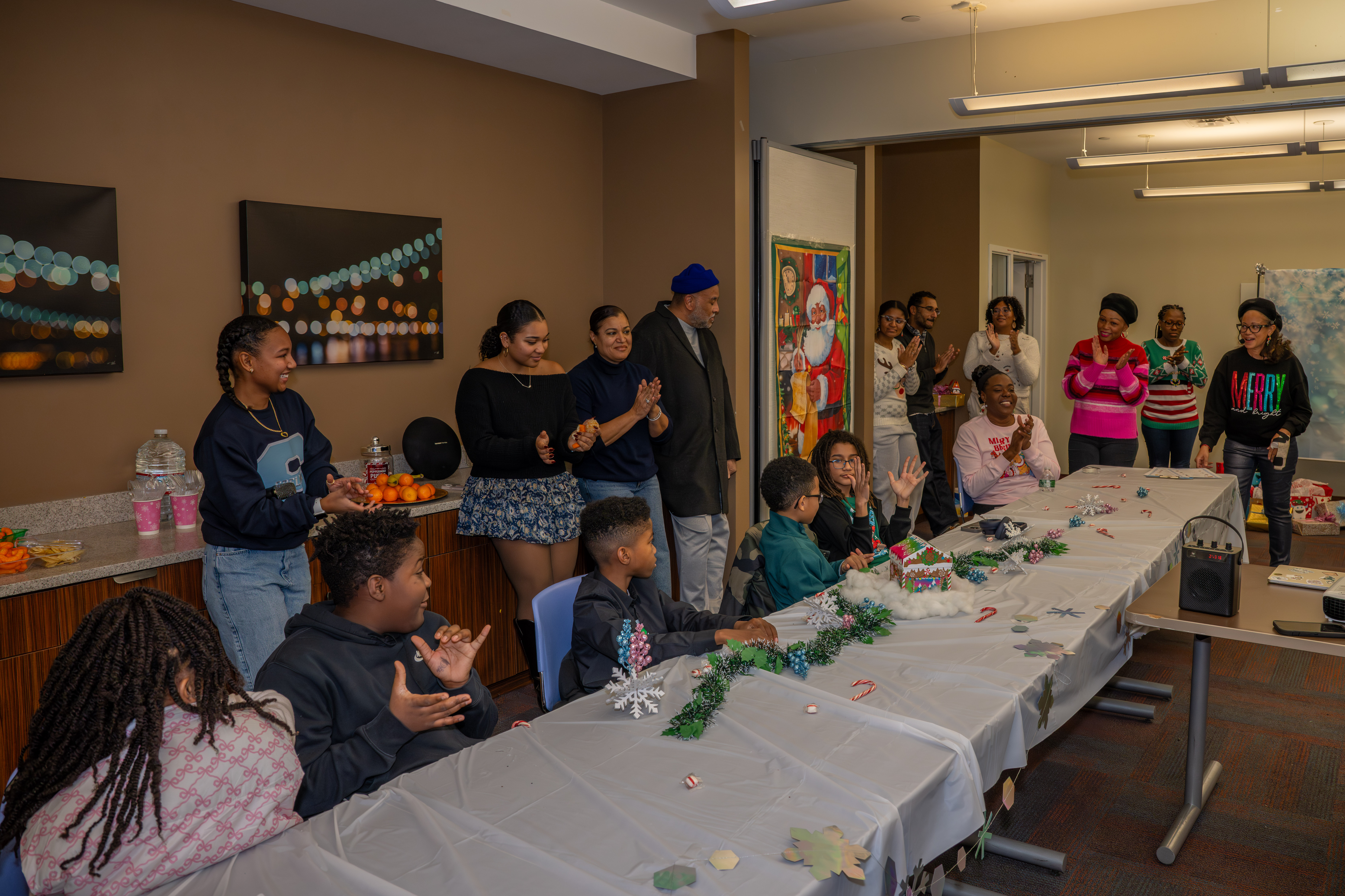 Kamora Freelend, the youngest African-American female pilot to earn her private license, and student pilot Sophie Robinson speak to middle school students at a meeting of Jack and Jill of America, Staten Island Tweens at the College of Staten Island in Willowbrook on Saturday, Dec. 20, 2025. (Owen Reiter for the Advance/SILive.com)
