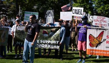 Immigration advocates sand in Voorhees Park in Fulton to discuss the Cato ICE raid