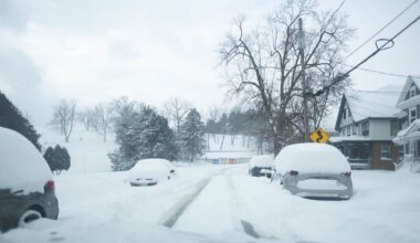 a very snowy residential street in syracuse new york