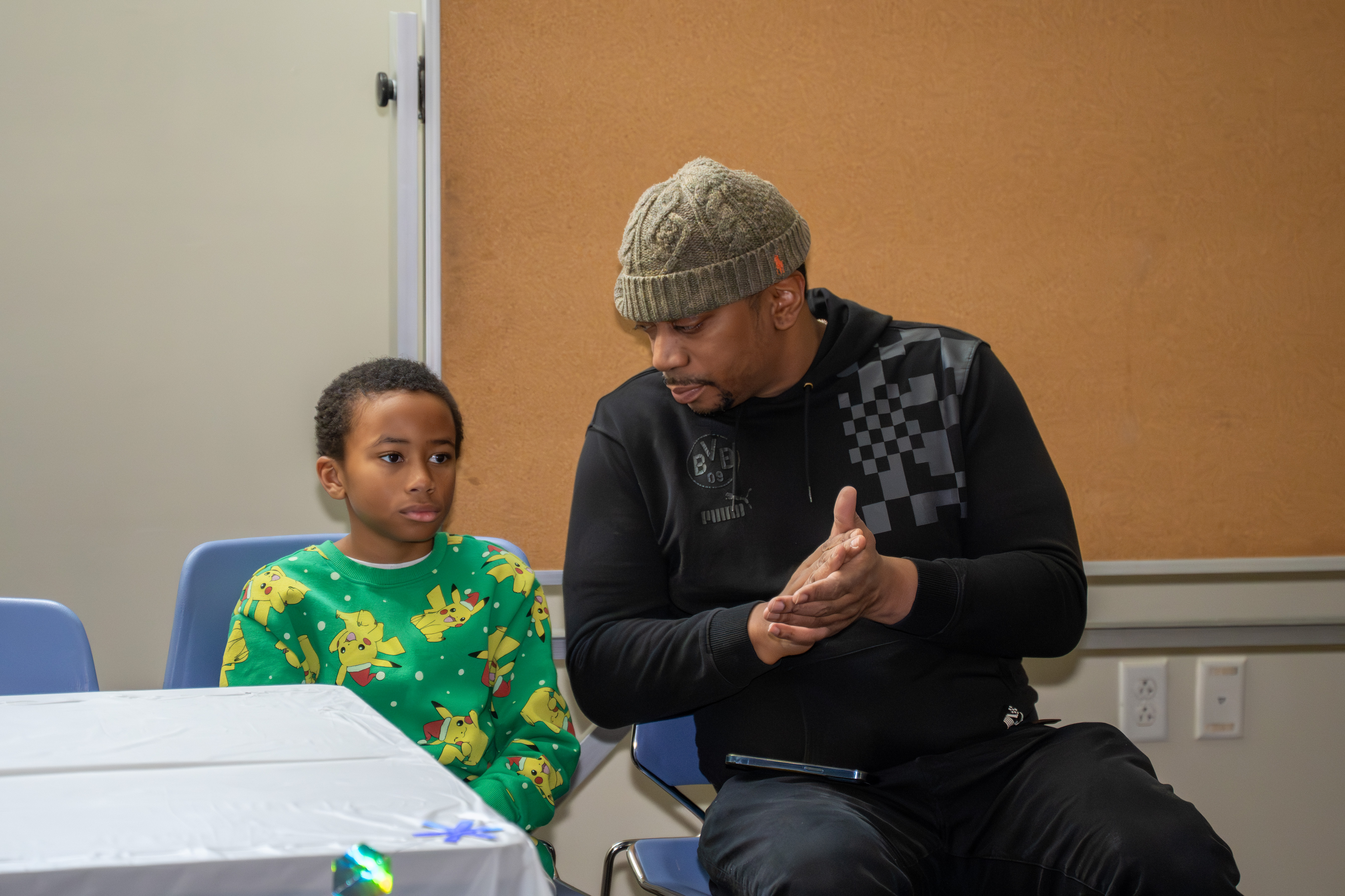 Kamora Freelend, the youngest African-American female pilot to earn her private license, and student pilot Sophie Robinson speak to middle school students at a meeting of Jack and Jill of America, Staten Island Tweens at the College of Staten Island in Willowbrook on Saturday, Dec. 20, 2025. (Owen Reiter for the Advance/SILive.com)