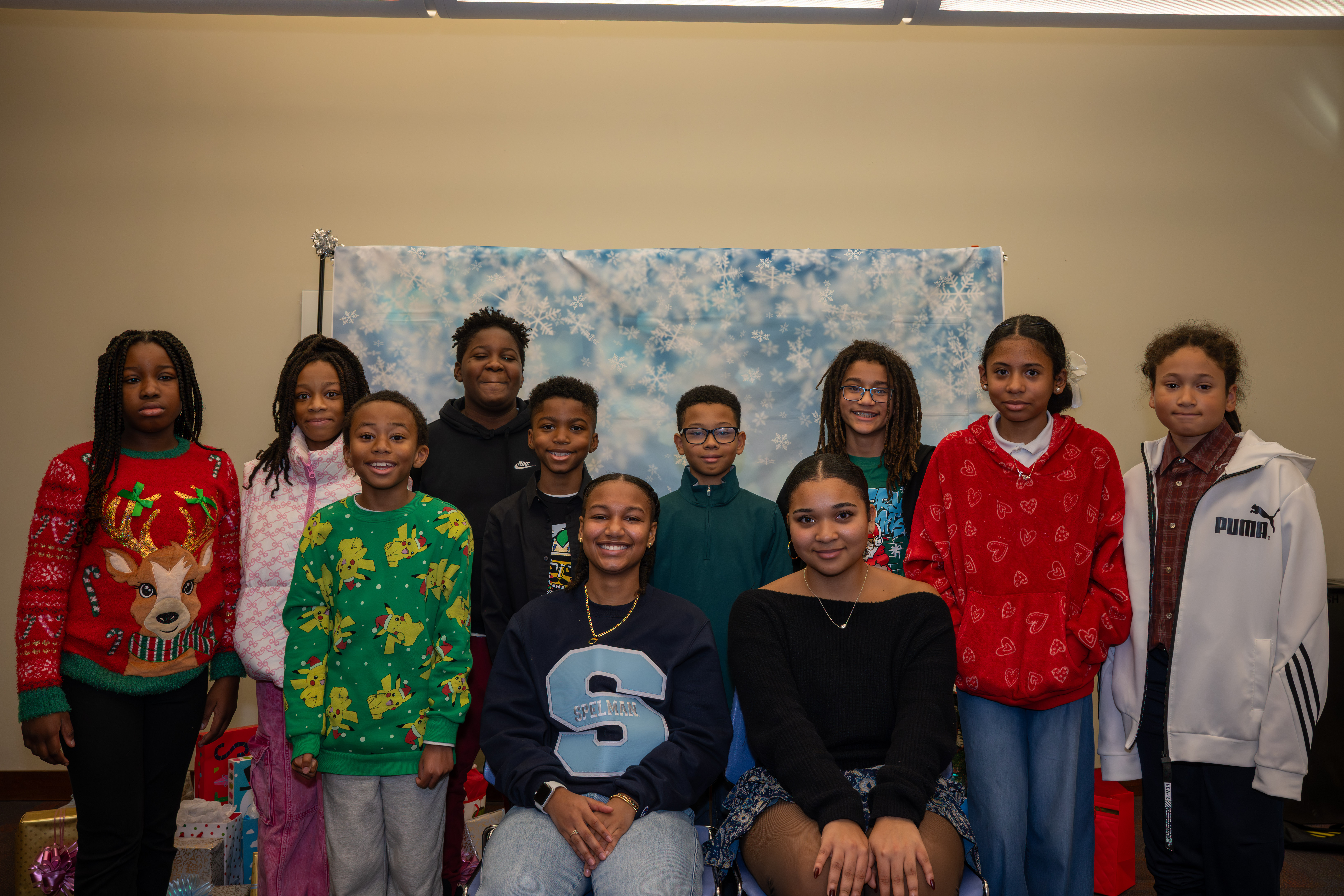 Kamora Freelend (wearing a Spelman College shirt), the youngest African-American female pilot to earn her private pilot license, and student pilot Sophie Robinson with middle school students at a meeting of Jack and Jill of America, Staten Island Tweens at the College of Staten Island in Willowbrook on Saturday, Dec. 20, 2025. (Owen Reiter for the Advance/SILive.com)