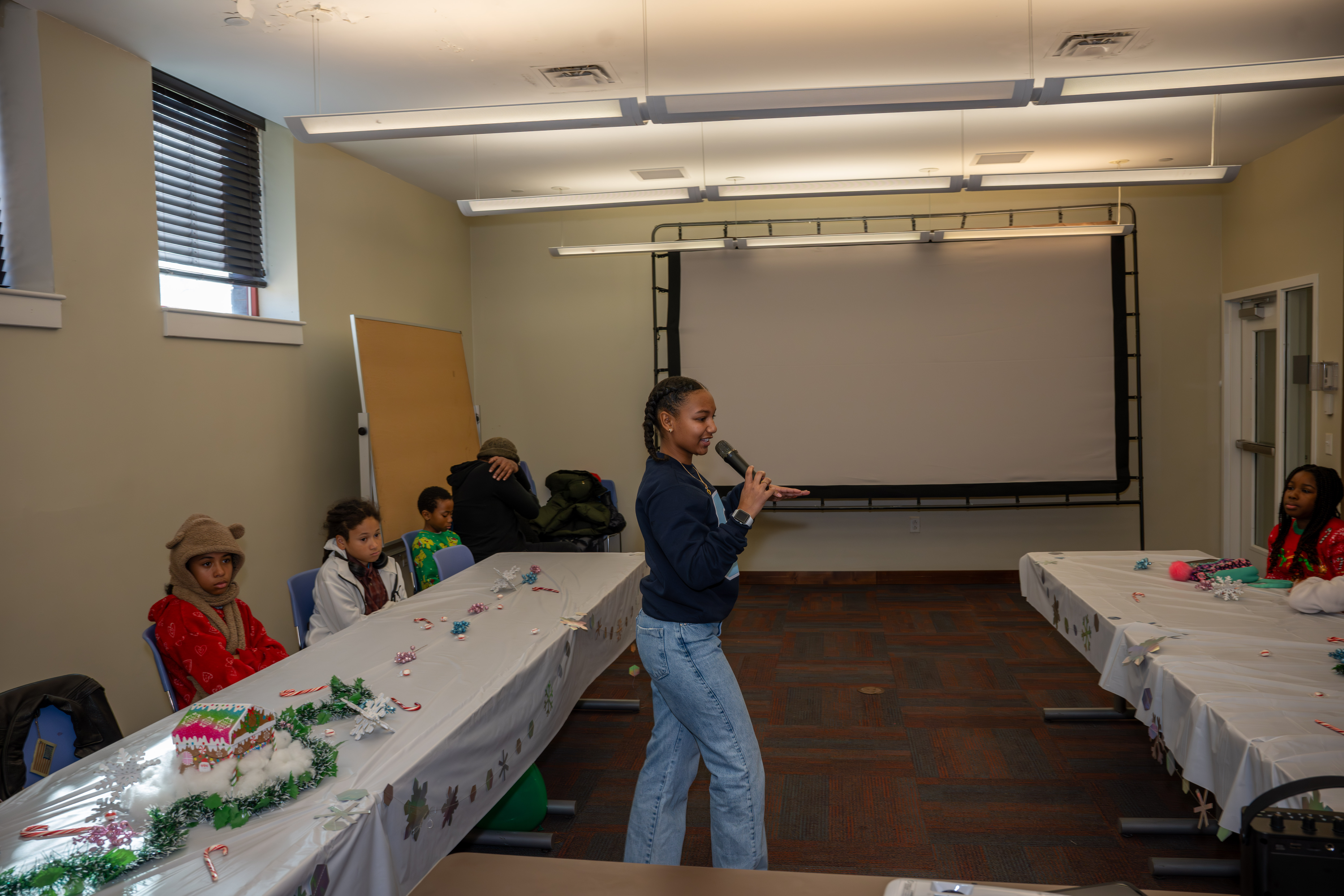 Kamora Freelend, the youngest African-American female pilot to earn her private pilot's license, speaks to middle school students at a meeting of Jack and Jill of America, Staten Island Tweens, at the College of Staten Island in Willowbrook on Saturday, Dec. 20, 2025. (Owen Reiter for the Advance/SILive.com)