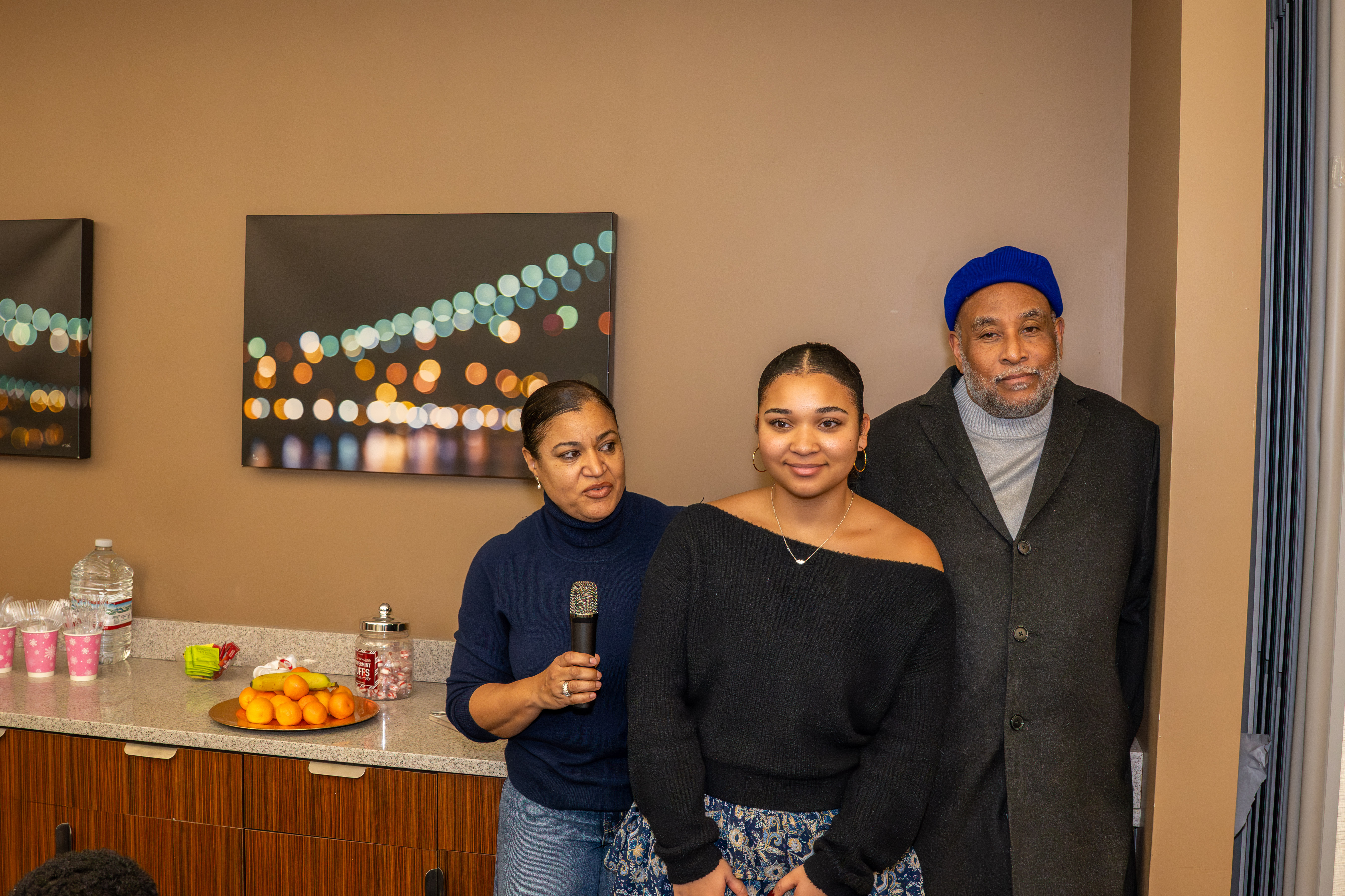 Martine Henriguez speaks as her daughter, Sophie Robinson, 16, and Sophie’s dad, Lenny Robinson, listen at a meeting of Jack and Jill of America, Staten Island Tweens, at the College of Staten Island in Willowbrook on Saturday, Dec. 20, 2025. (Owen Reiter for the Advance/SILive.com)