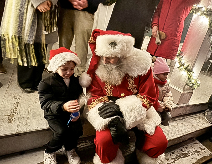 Santa with neighborhood children at the tree lighting at Historic Richmondtown on Dec. 5, 2025. (Steve White for the Advance/SILive.com)