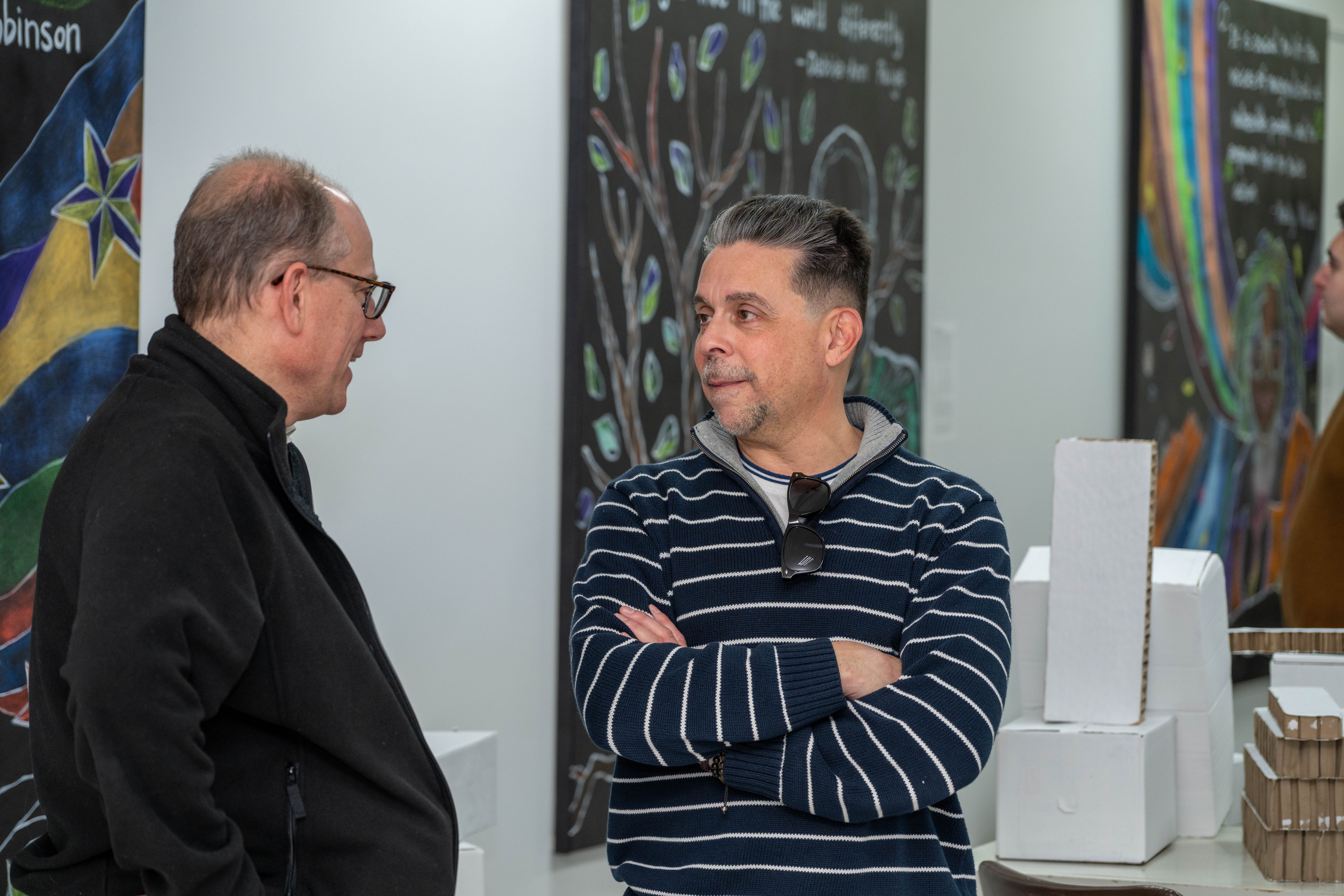 Judge Raymond L. Rodriguez, on the right, attends the grand opening of the Staten Island Urban Center’s new storefront at 206 Bay Street in Tompkinsville on Saturday, December 6, 2025. (Owen Reiter for the Advance/SILive.com)