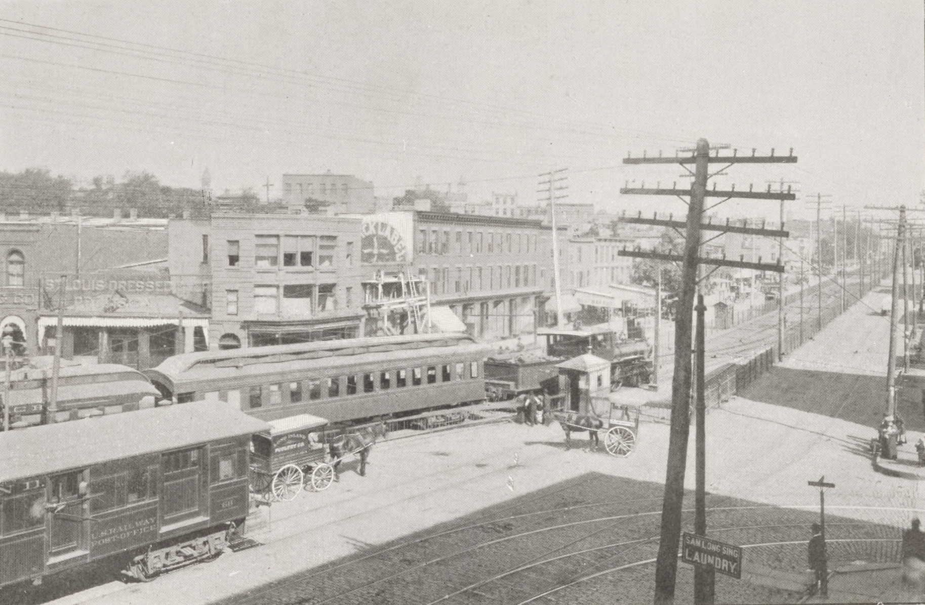 black and white image atlantic avenue showing buildings and trolleys, horses and carts