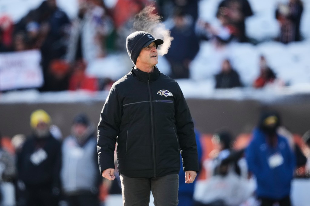 Baltimore Ravens head coach John Harbaugh on the field.