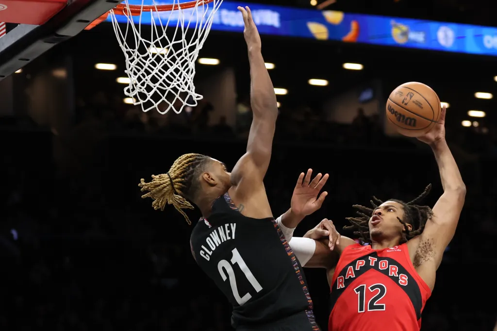 Brooklyn Nets forward Noah Clowney (21) blocks a shot by Toronto Raptors’ Collin Murray-Boyles (12) at the Barclays Center.