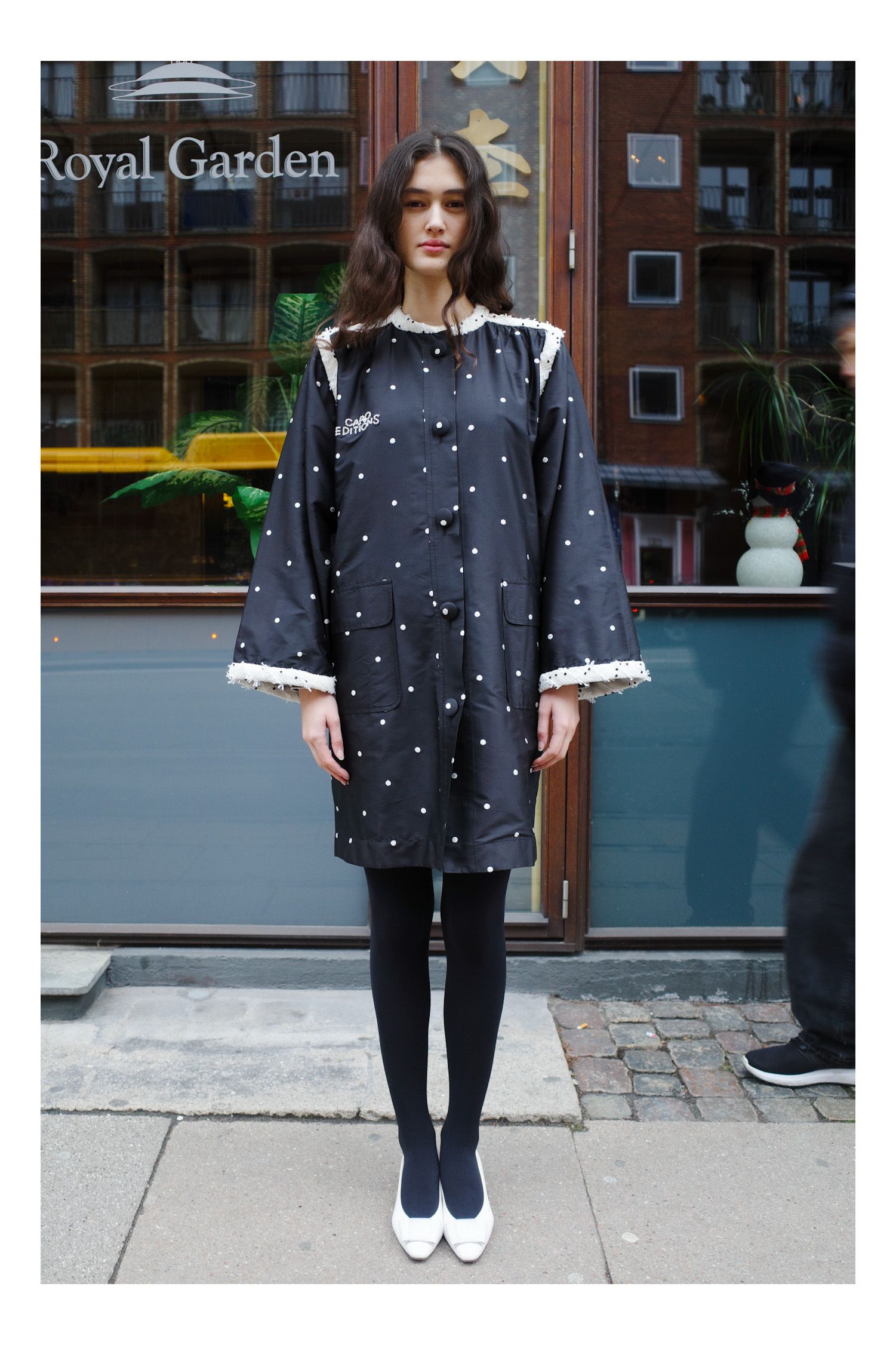 Image may contain Clothing Coat Dress Person and Teen