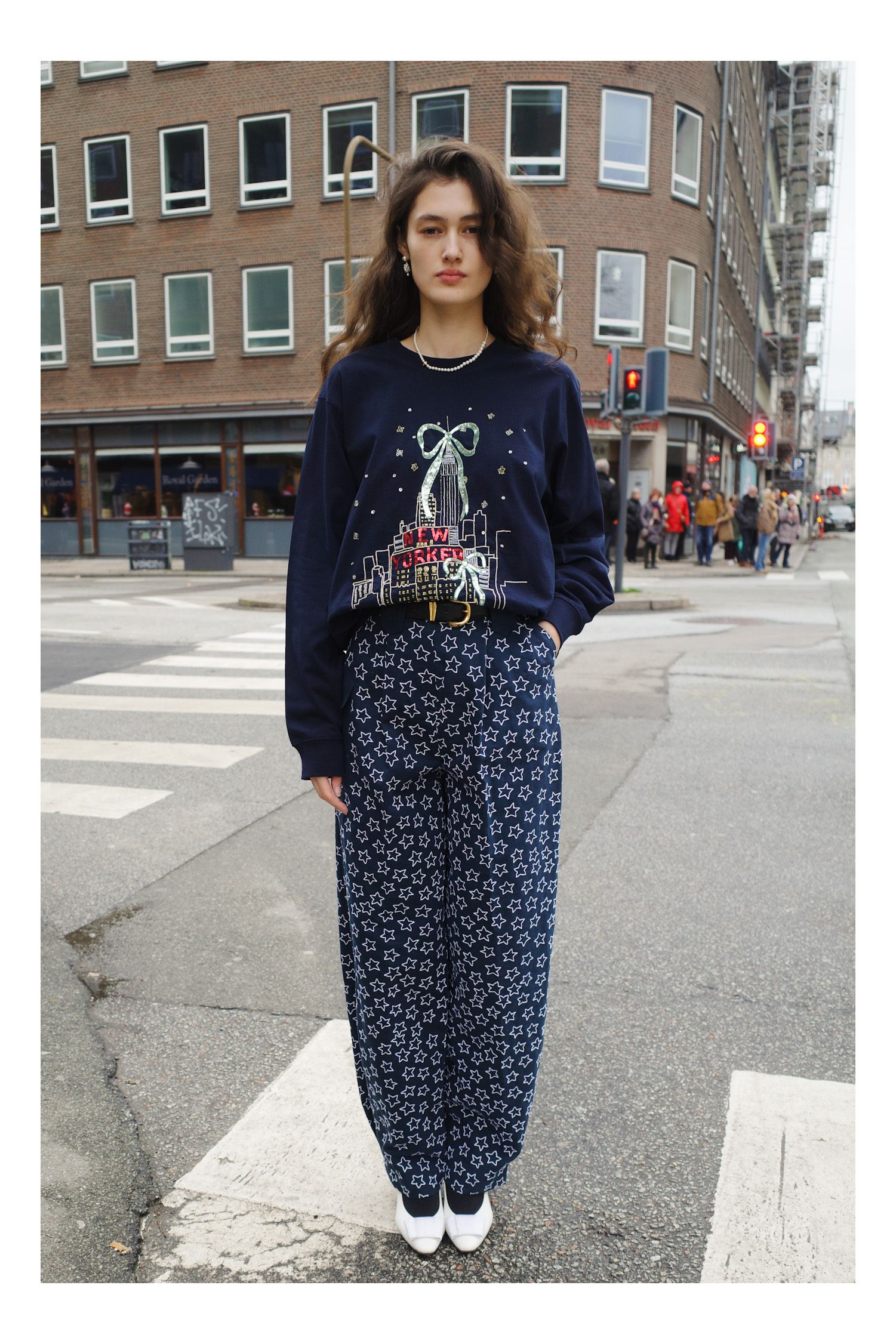 Image may contain Clothing Pants Long Sleeve Sleeve Person Standing Car Transportation Vehicle Adult and City