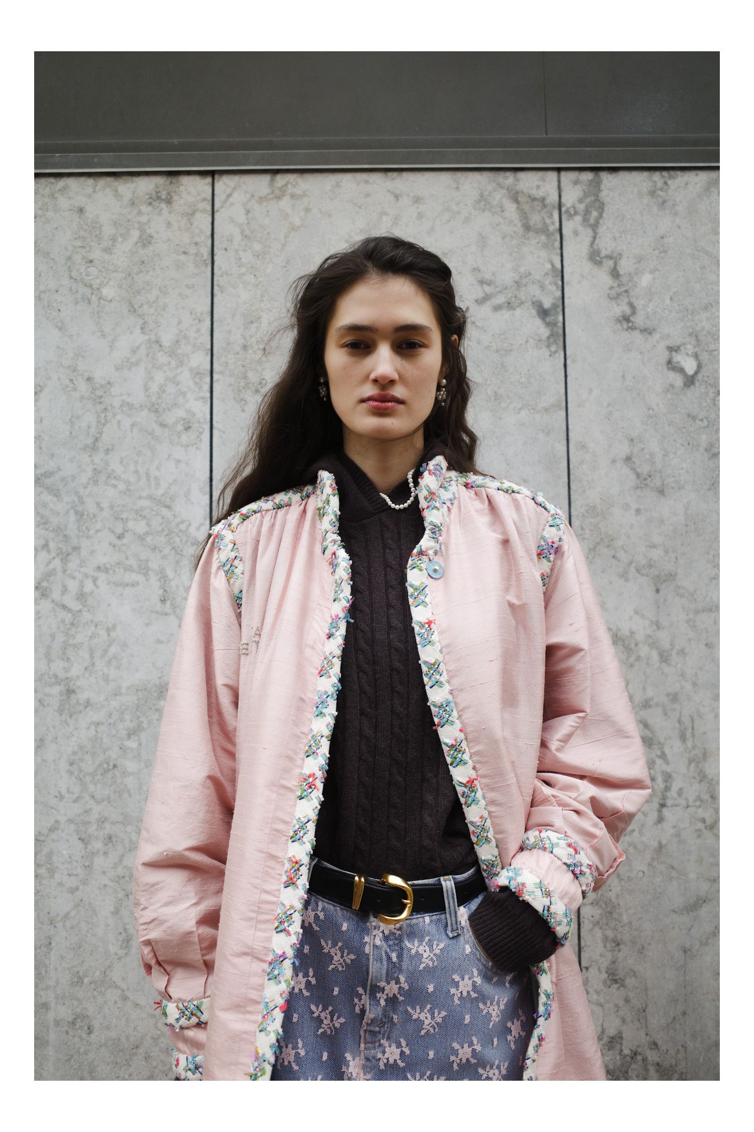 Image may contain Blouse Clothing Coat Long Sleeve Sleeve Jacket Blazer Adult Person Face Head and Photography