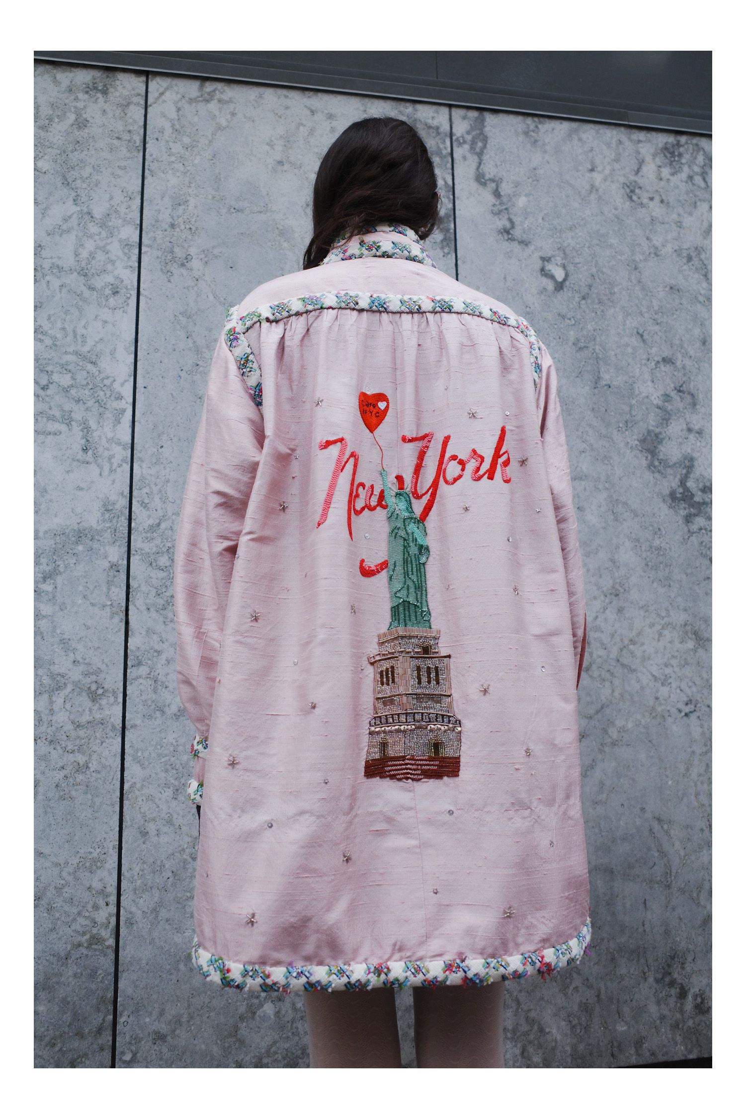 Image may contain Clothing Coat Long Sleeve Sleeve Dress Fashion Formal Wear Gown Robe Adult and Person