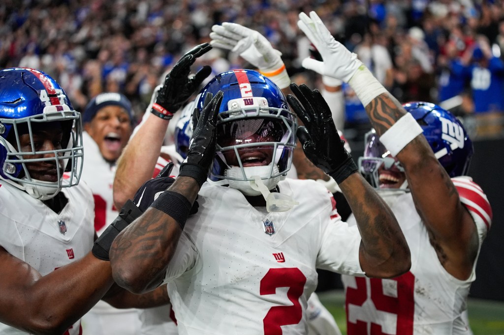 New York Giants cornerback Deonte Banks (2) celebrates his touchdown with teammates.