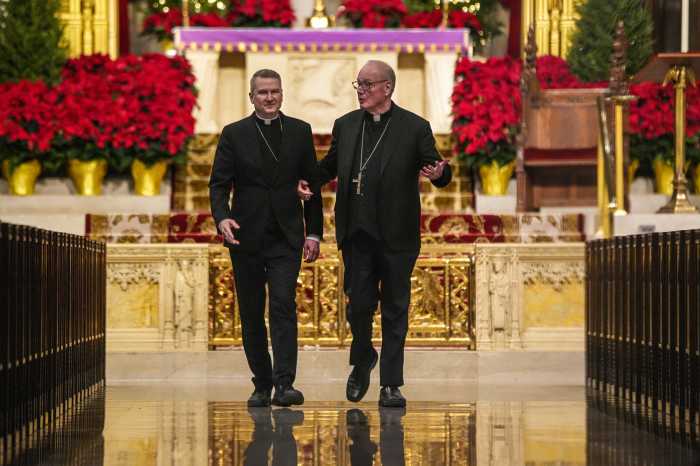 Cardinal Dolan and Bishop Ronald Hicks walking down aisle at St. Patrick's Cathedral