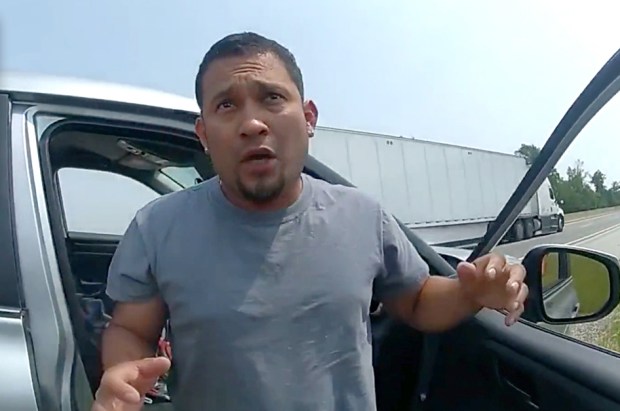 In this screenshot from a state trooper's body worn camera footage, Edenilson Velasquez Larin, a purported leader of the "MS-13" gang, leaves a vehicle after a traffic stop on the turnpike near Ohio 53 on Wednesday, June 7, 2023. (OHIO STATE HIGHWAY PATROL)
