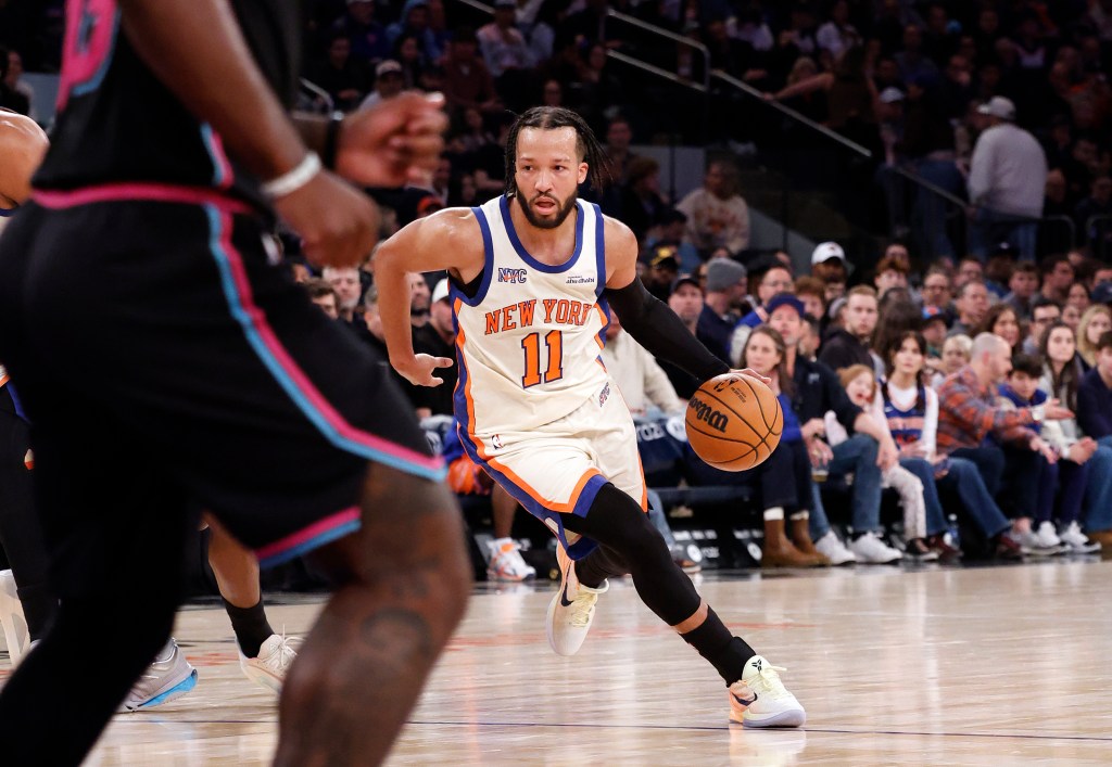 New York Knicks guard Jalen Brunson drives down court with the basketball.