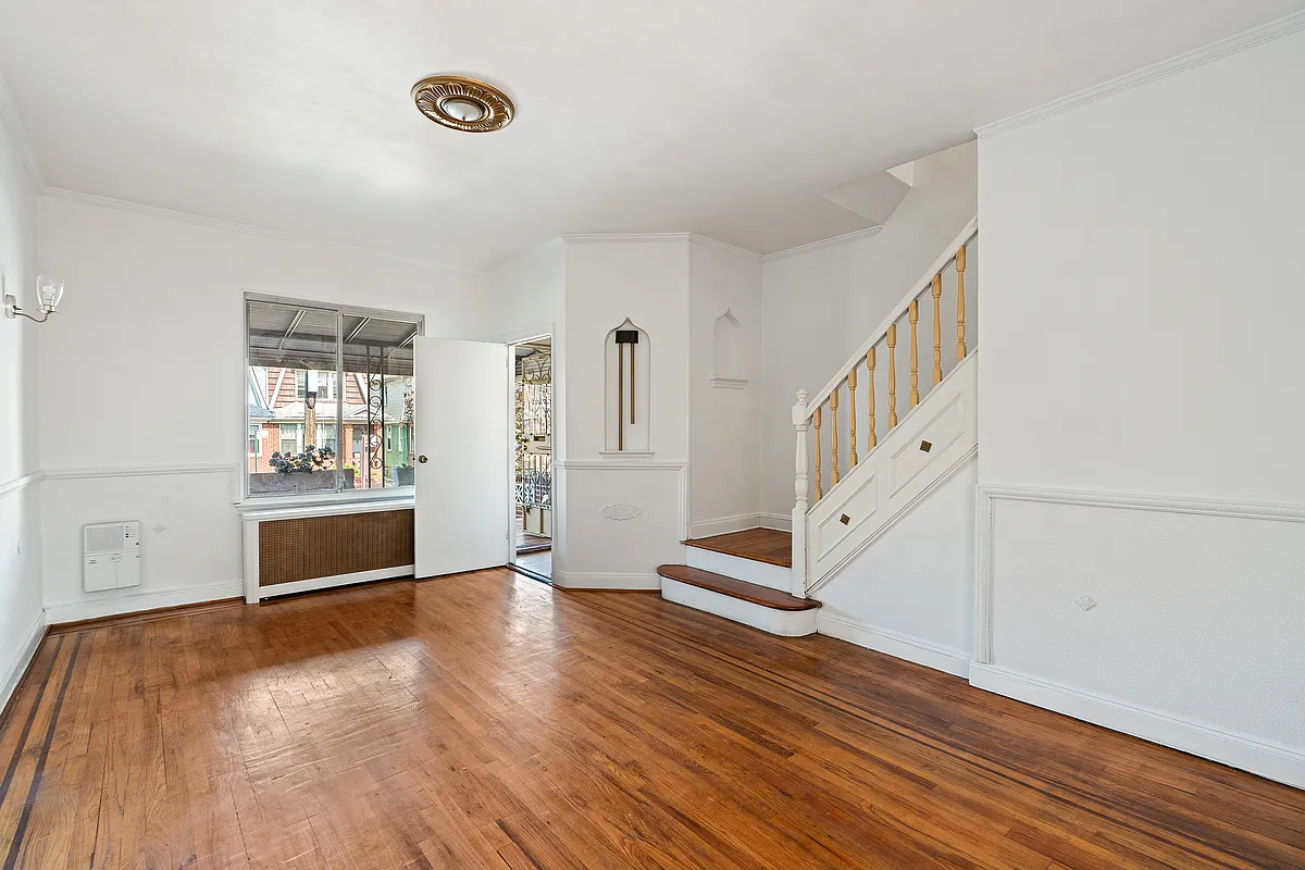 living room with wood floor, niches