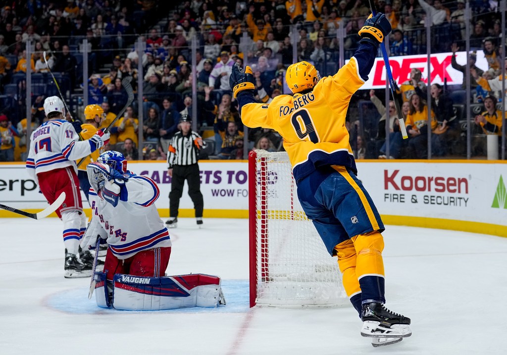 Filip Forsberg of the Nashville Predators celebrates a goal against New York Rangers goalie Jonathan Quick.