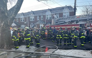 Firefighters battled a three-alarm house fire in Whitestone on Christmas Day that spread to two neighboring homes. 