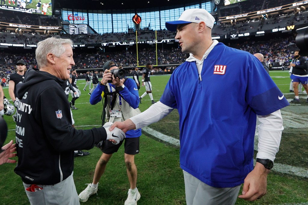 Pete Carroll and Mike Kafka shake hands after the Las Vegas Raiders vs. New York Giants game.