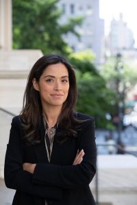 A woman with her arms folded.