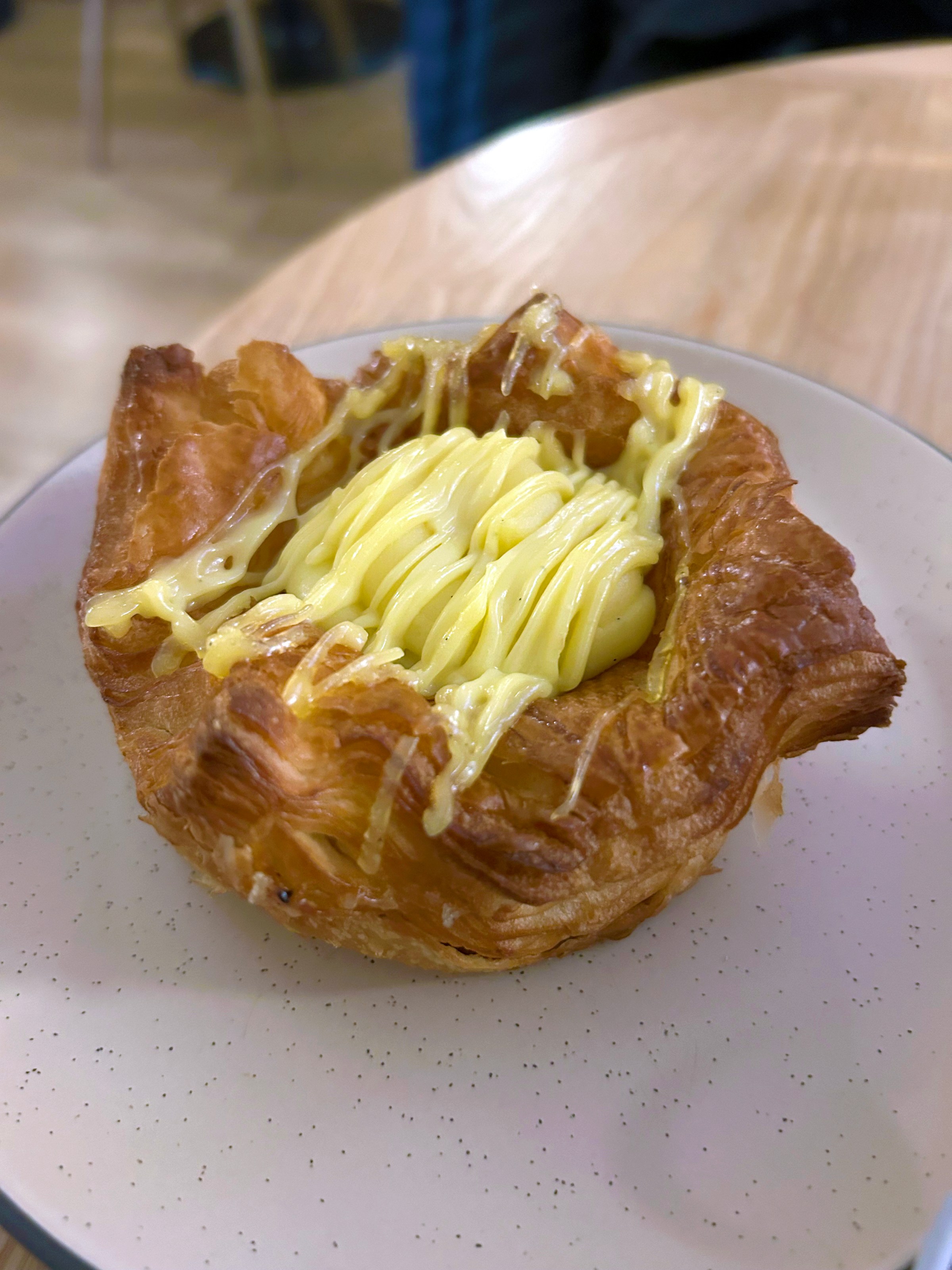 A pastry with yellow cream.