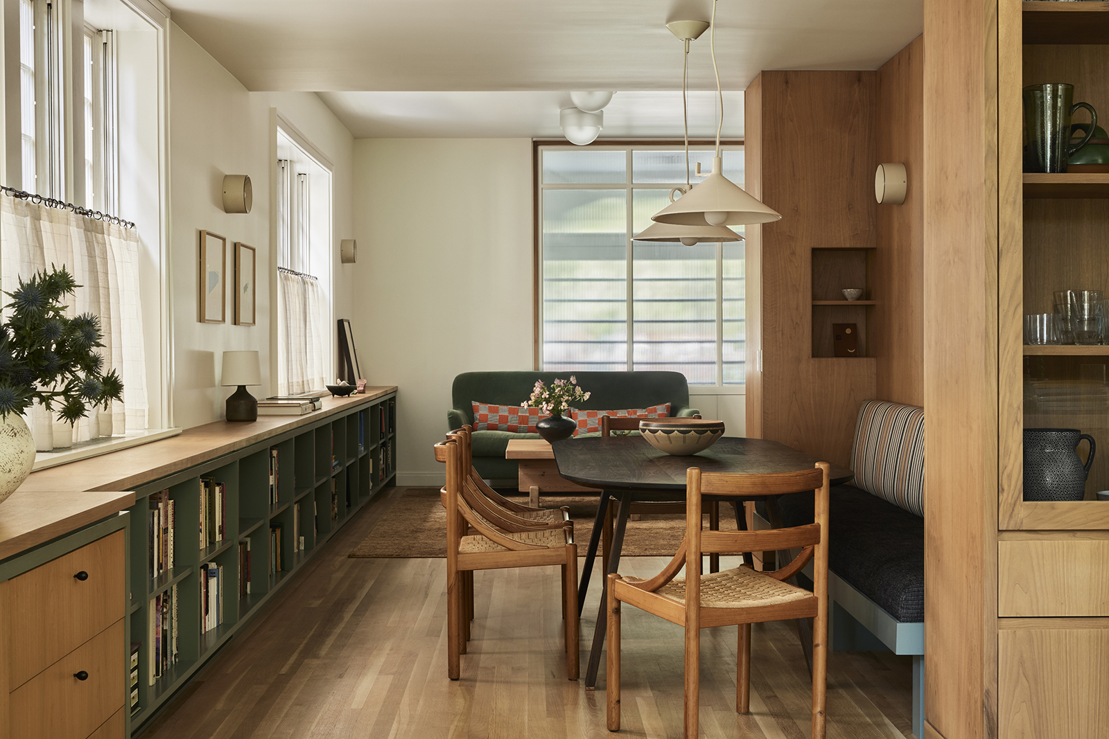 DINING AREA WITH LOW WALL OF BOOKSHELVES