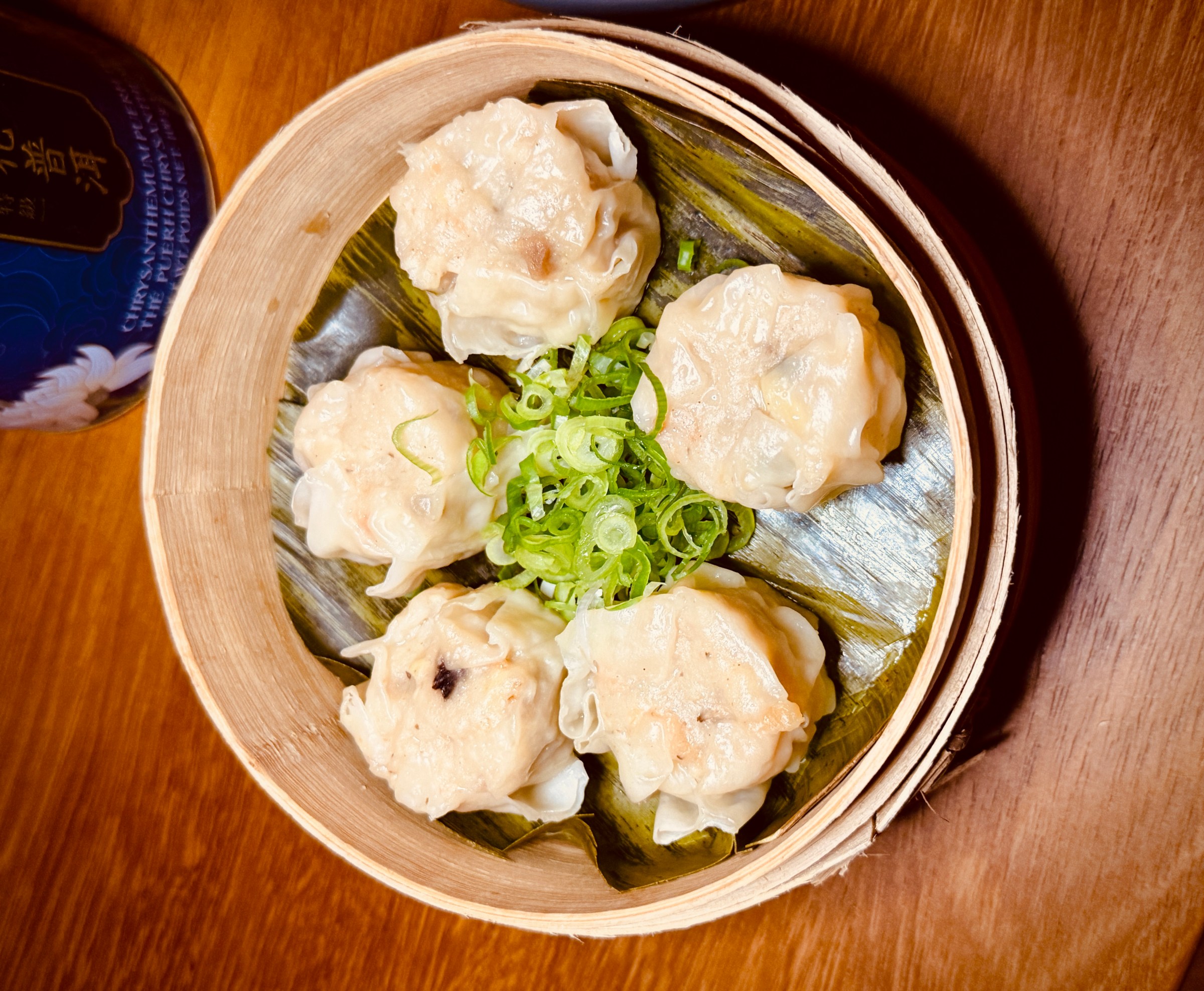 Dumplings in a steamer basket.