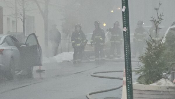 Firefighters in Monday’s early-morning fog responding to the Smith Street manhole explosions. Photo courtesy of Dwidson Metayer