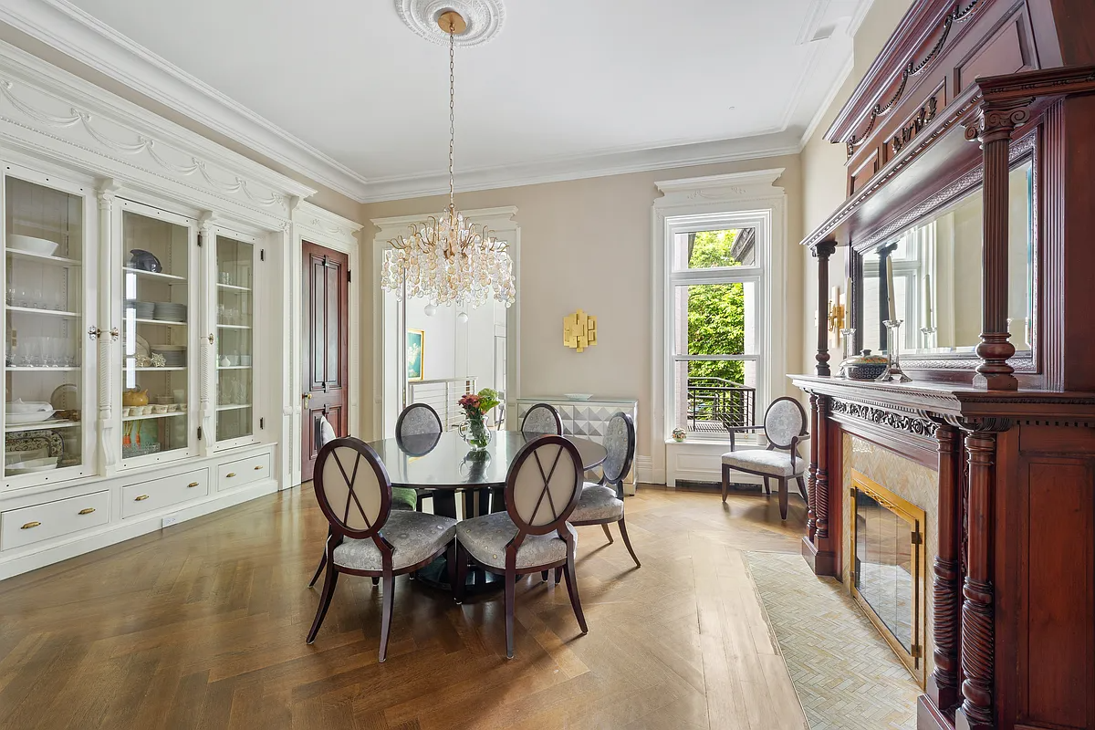 dining room with mantel, built-ins