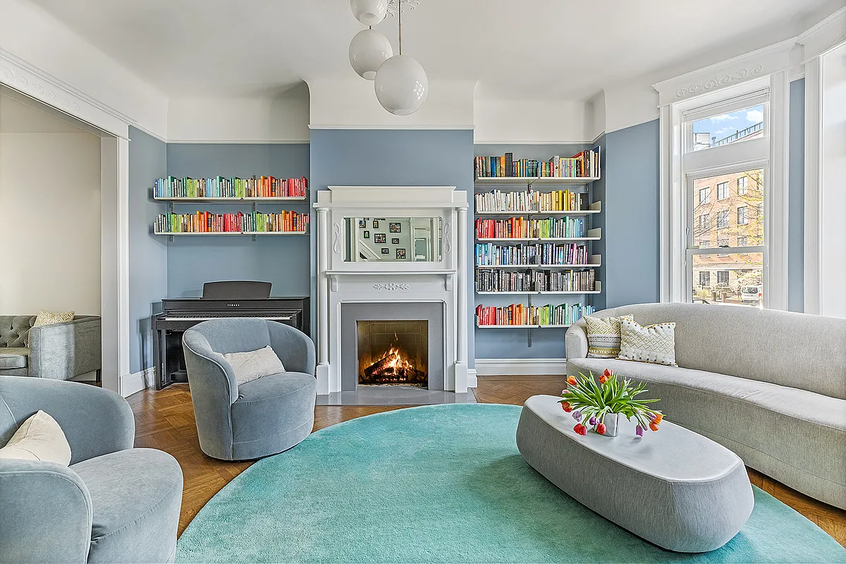 parlor with a mantel and blue walls