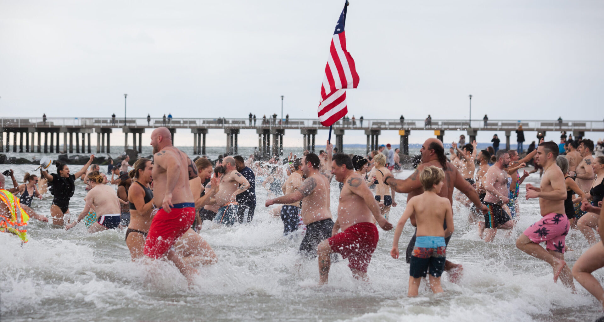 Thousands of people rush into the waters off Coney Island to welcome in the new year.Photo by Paul Frangipane/Brooklyn Eagle
