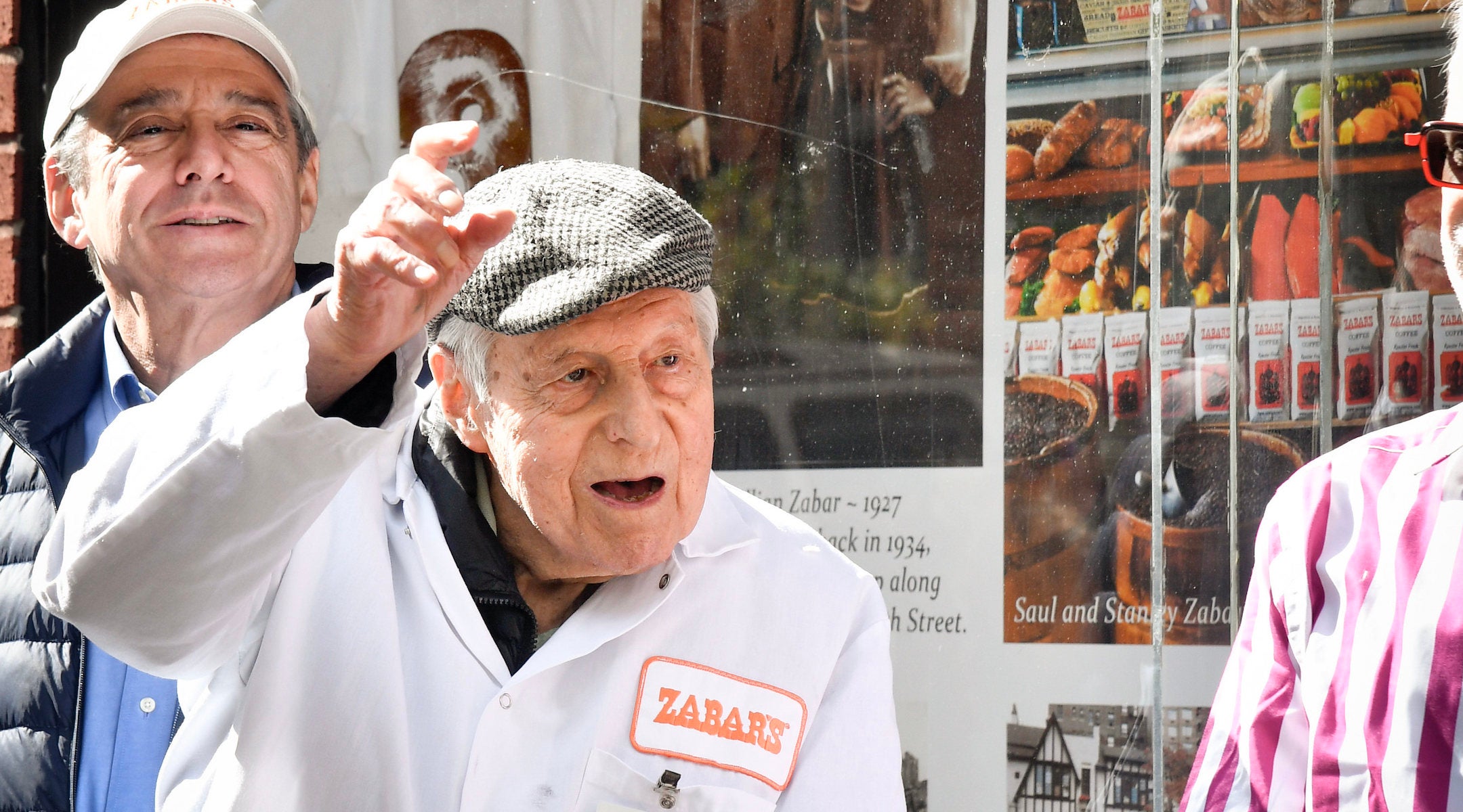 Saul Sabar waves while wearing a Zabar's uniform.