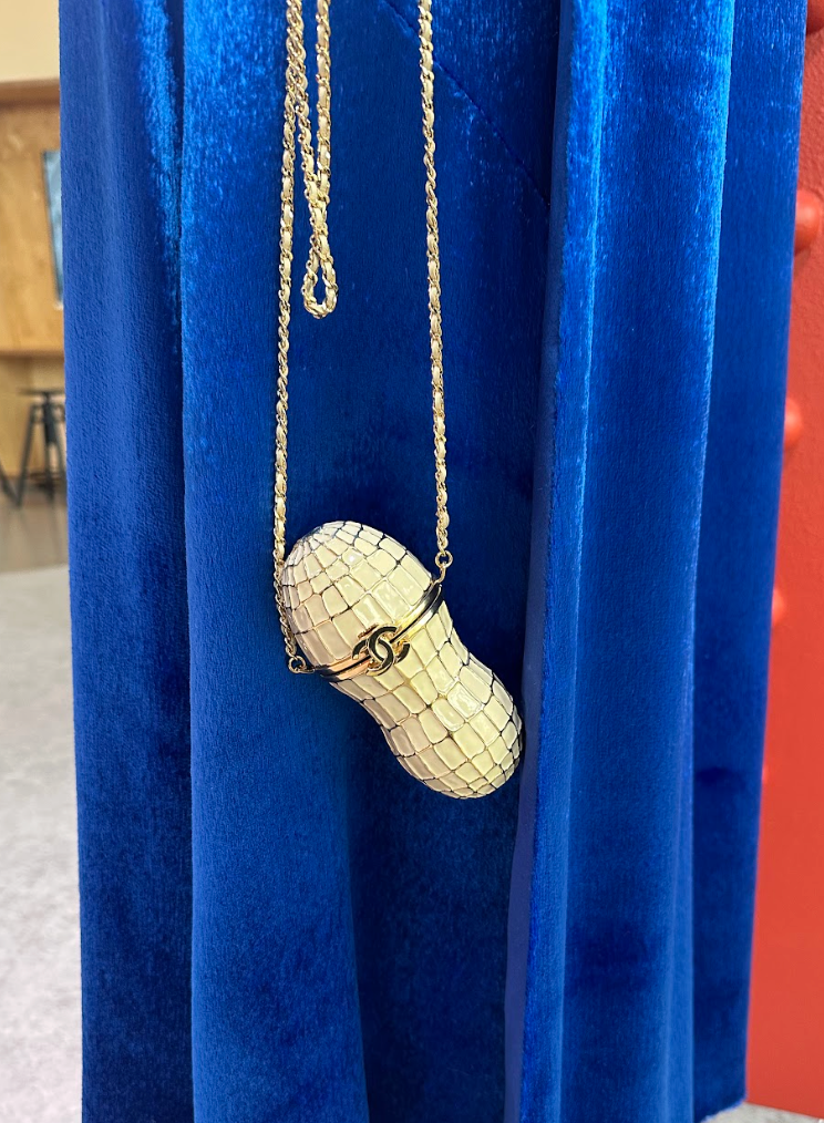 peanutshaped handbag with chain strap and logo