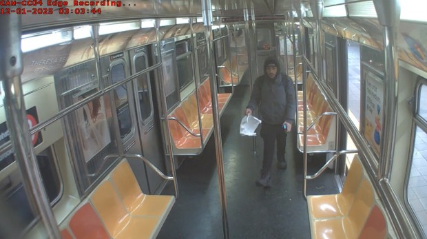 Newly unveiled surveillance images show suspected arsonist Hiram Carrero aboard a northbound No. 2 train, where he used a lit piece of paper to ignite the clothes of a sleeping homeless man. (US Attorney's Office) 