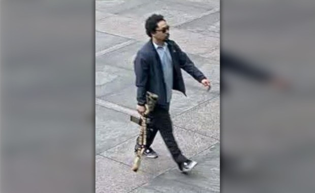 Footage obtained by the Daily News shows Shane Tamura carrying an assault rifle before entering 345 Park Ave. in Manhattan on Monday, July 28, 2025. (Obtained by Daily News) 