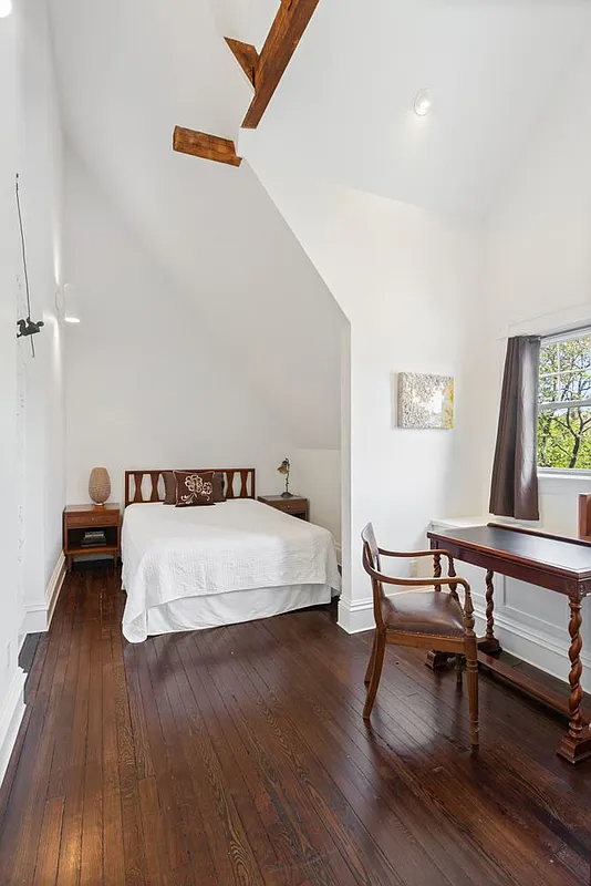 top floor bedroom with white walls