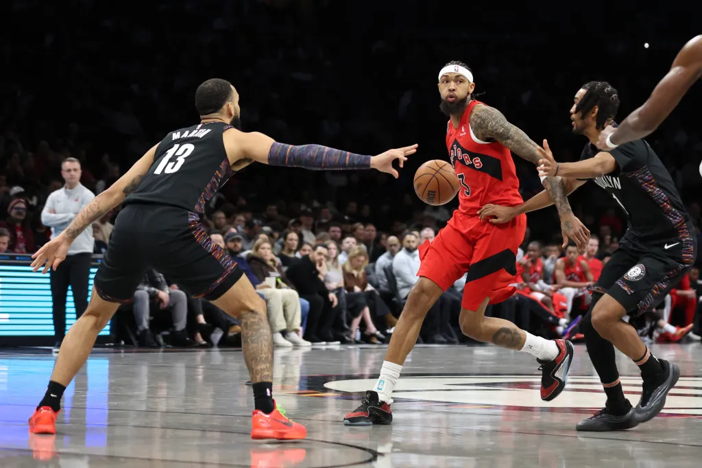 Toronto Raptors' Brandon Ingram (3) is defended by Brooklyn Nets guard Tyrese Martin (13) and forward Ziaire Williams (1).