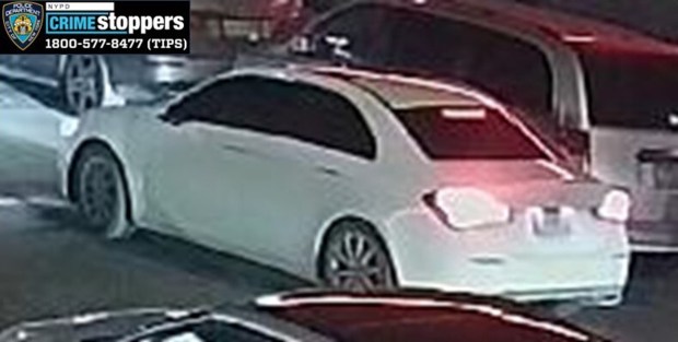 Two of the suspects jumped into a white sedan with dark-tinted windows on E. 236th St.