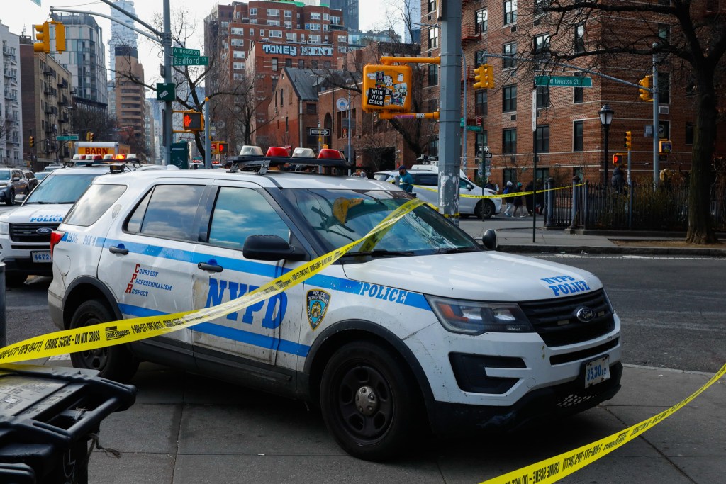 NYPD officers guard a crime scene in Greenwich Village,