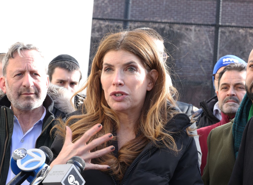 NYC Council Speaker Julie Menin speaking to reporters at Gravesend Park with Jewish community leaders present.