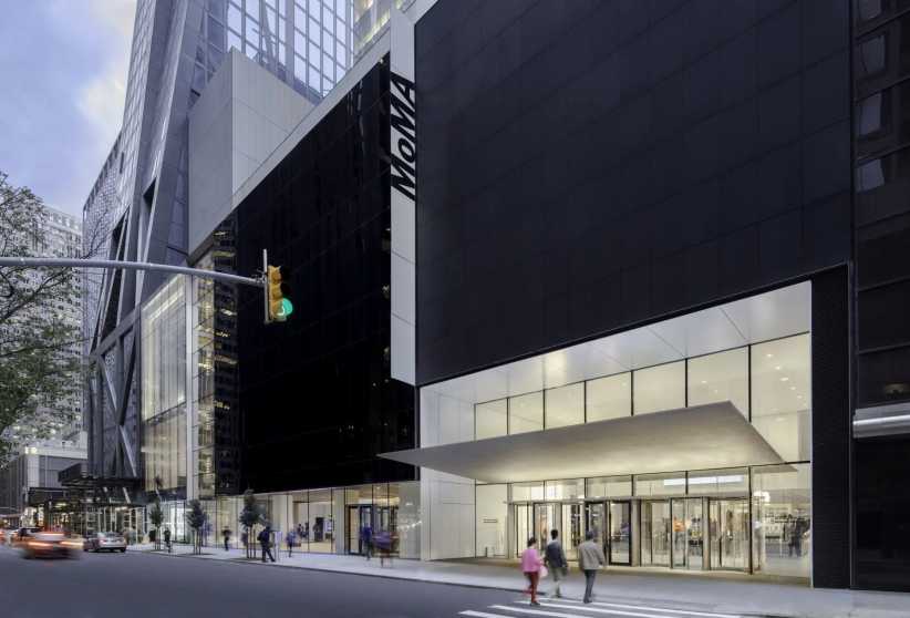 The exterior of the Museum of Modern Art (MoMA) in New York, with its bold black-and-white entrance and sidewalk scene.