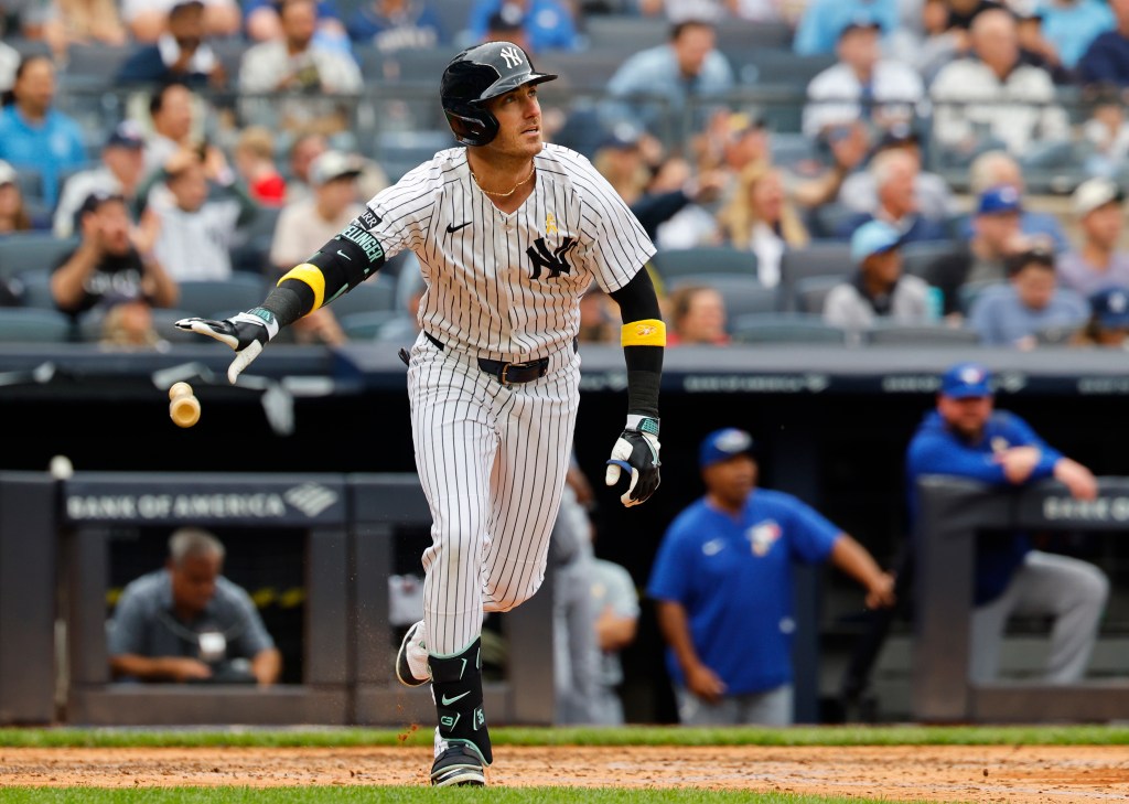 New York Yankees Cody Bellinger tosses his bat after hitting a RBI double during the third inning of a MLB baseball game against the Toronto Blue Jays at Yankee Stadium. Sunday, Sept. 7, 2025 in New York.