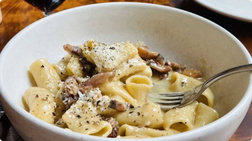 Close-up shot of pasta, butter and mushrooms at Ci Siamo, one of Yelp's Top 100 Places to Eat