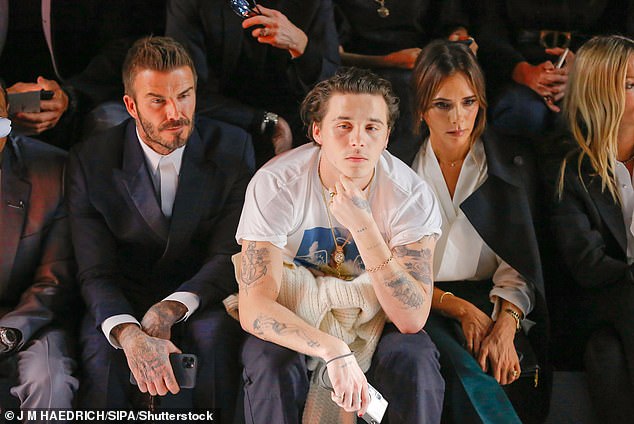 Brooklyn has been at the centre of a feud with the Beckham family that has pitted the influencer and his wife Nicola against his parents and brothers (Brooklyn, David and Victoria in 2020)