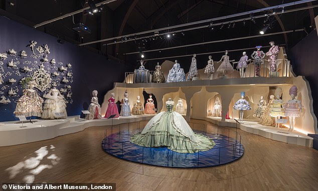 The exhibition culminates in a breathtaking gown-filled room showcasing Marie's lasting influence on fashion